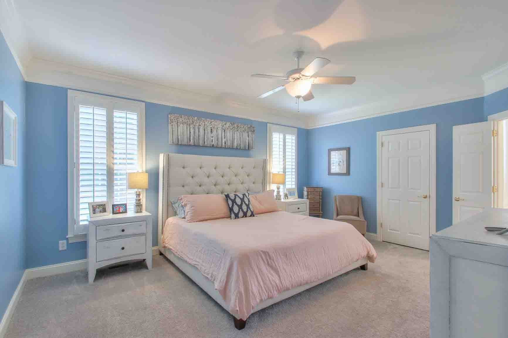 206 Polk Pl Drive Franklin, TN 37064 - Photo 19 of 47 a bedroom with a large bed and a chandelier