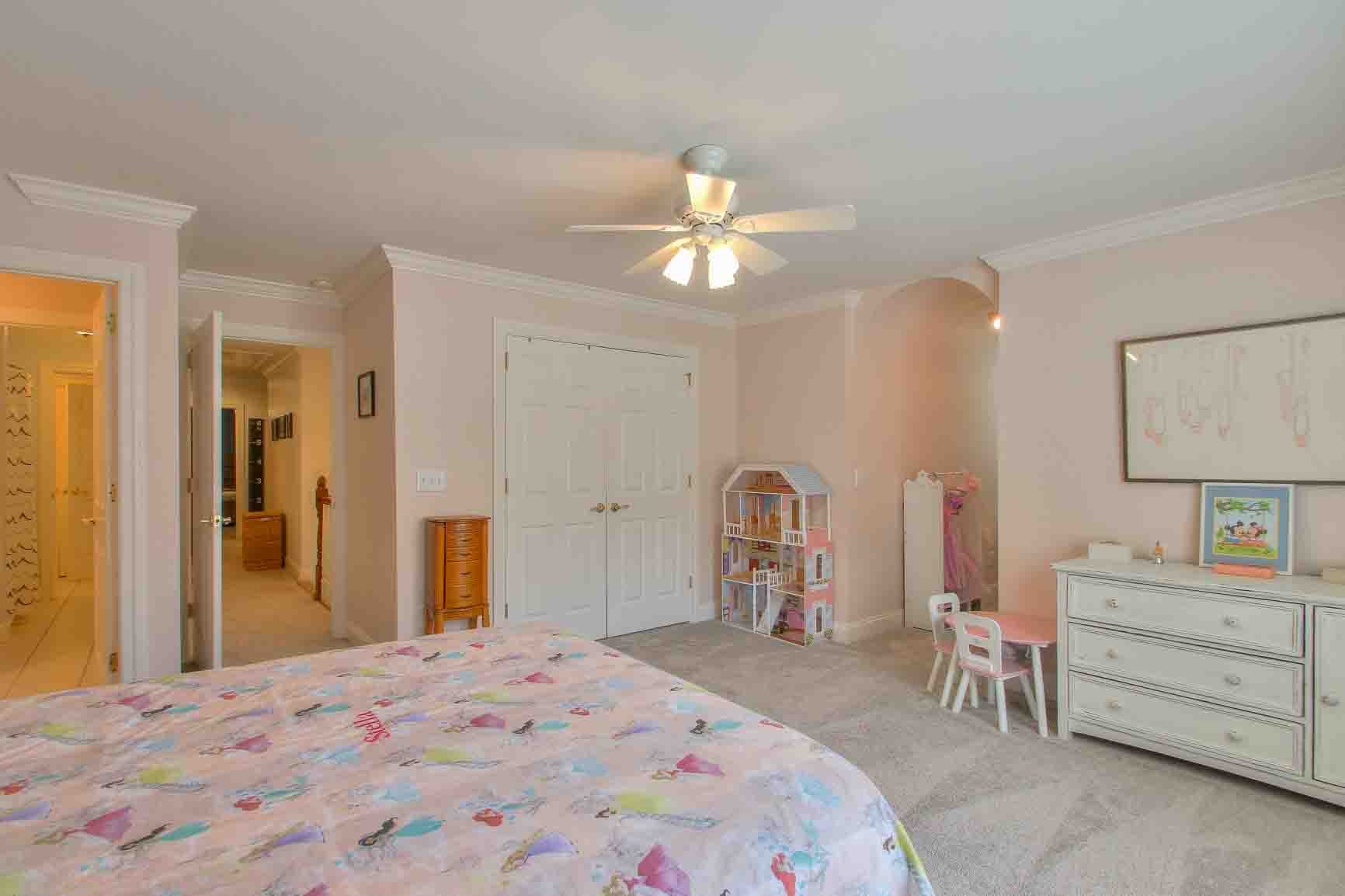 206 Polk Pl Drive Franklin, TN 37064 - Photo 27 of 47 a bedroom with a bed and a chandelier