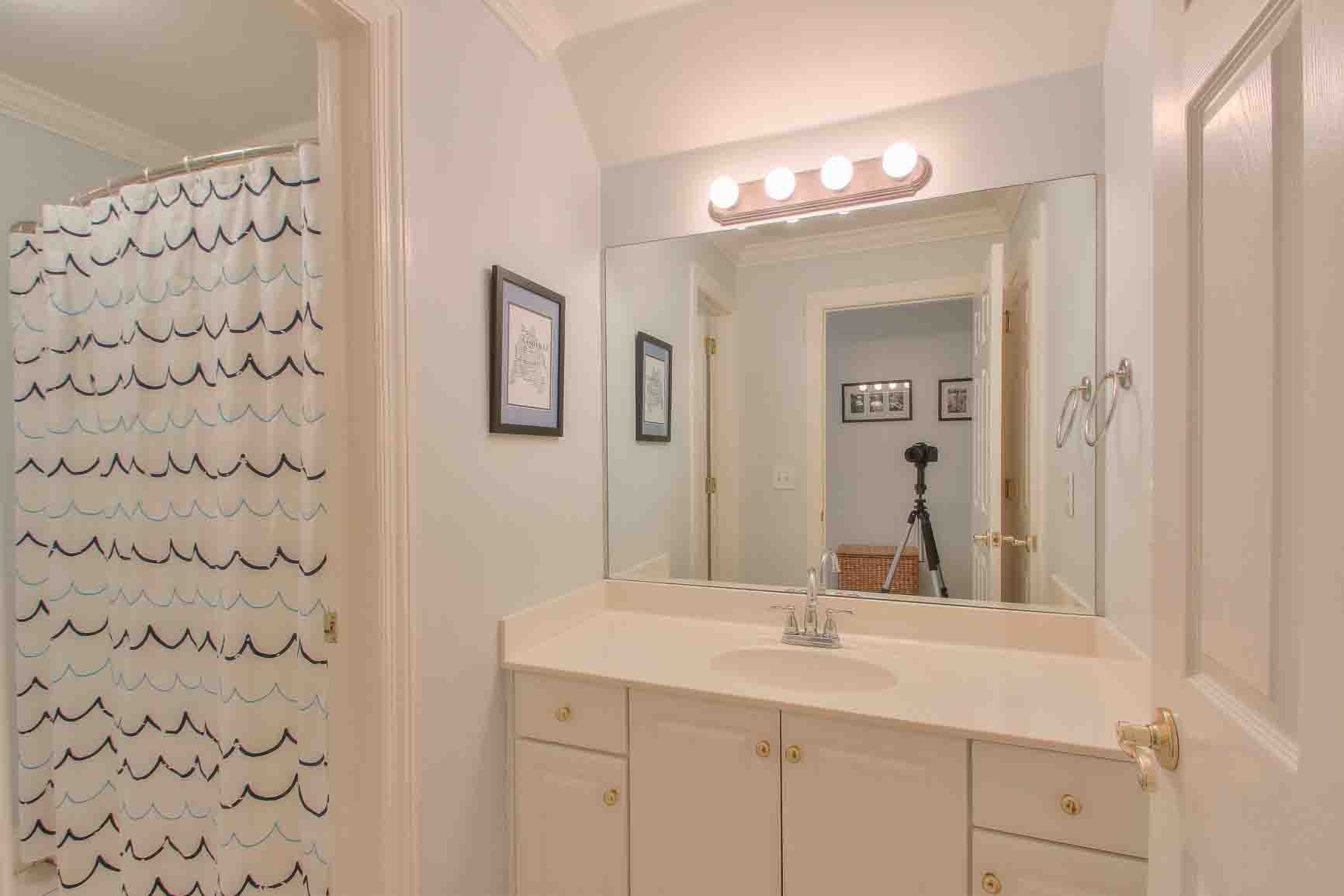 206 Polk Pl Drive Franklin, TN 37064 - Photo 29 of 47 a bathroom with a sink vanity and a mirror