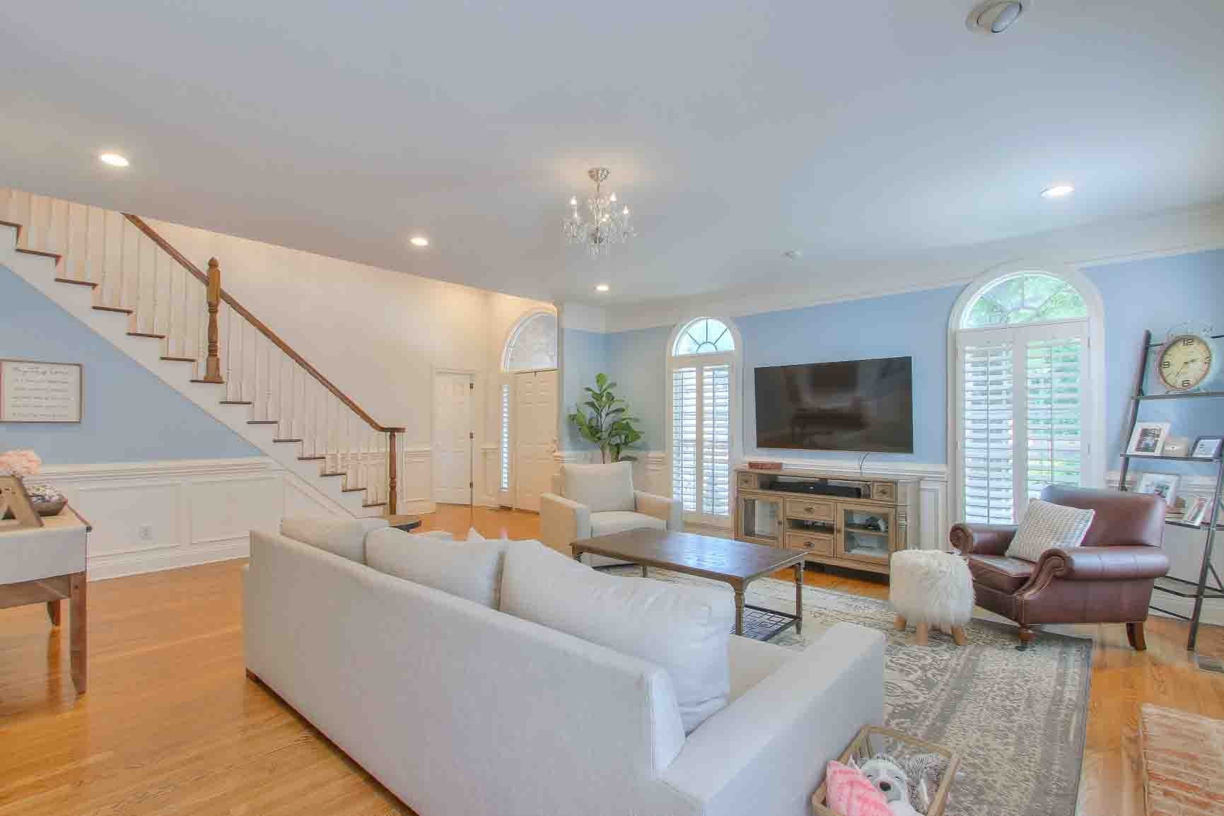 206 Polk Pl Drive Franklin, TN 37064 - Photo 4 of 47 a living room with furniture kitchen view and a flat screen tv