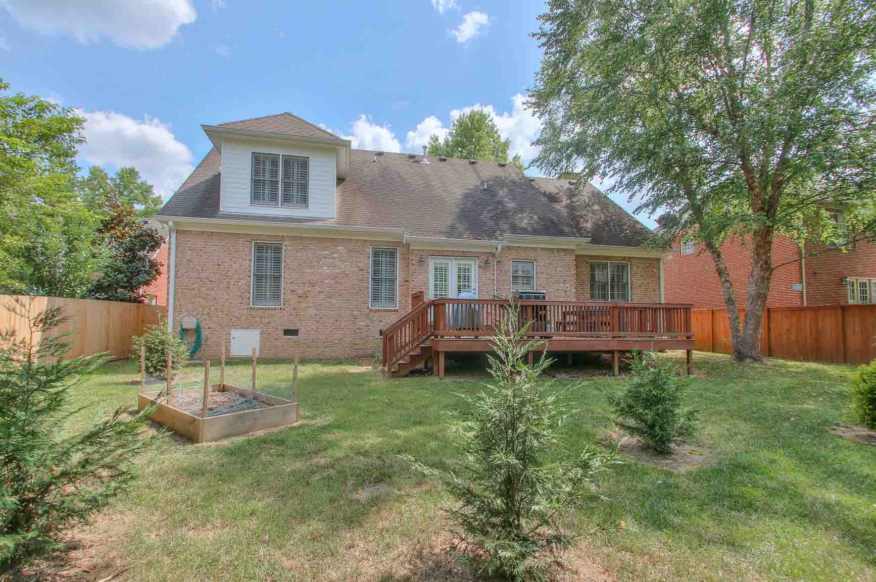 206 Polk Pl Drive Franklin, TN 37064 - Photo 40 of 47 a view of a house with a backyard and a patio