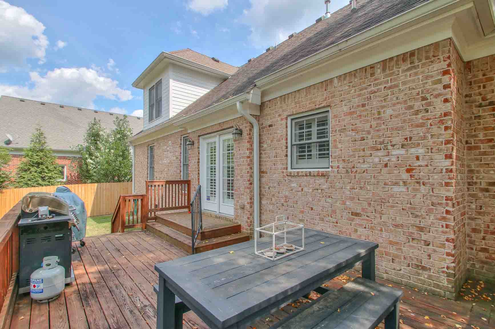 206 Polk Pl Drive Franklin, TN 37064 - Photo 41 of 47 a view of house with deck and outdoor seating