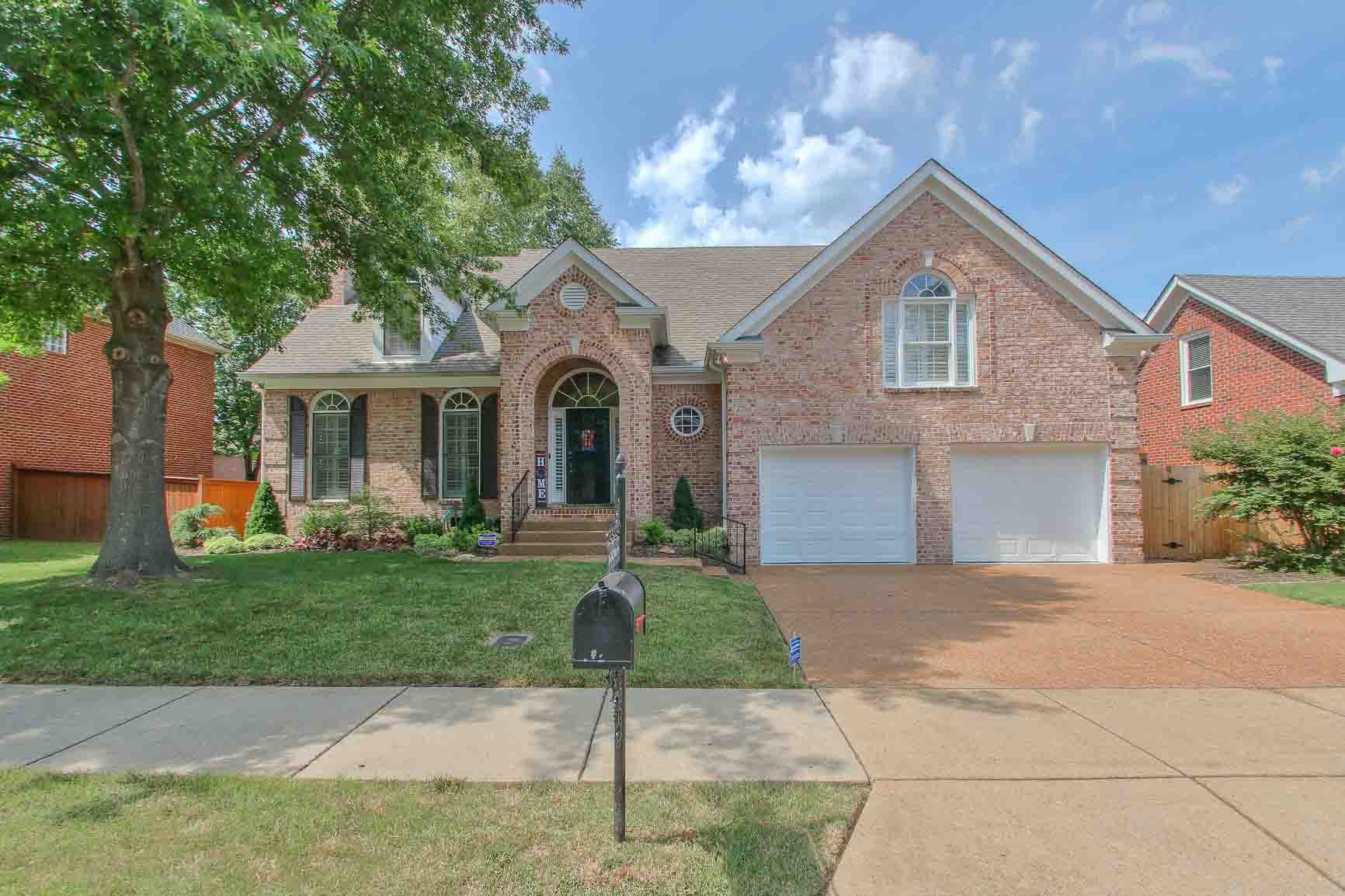 206 Polk Pl Drive Franklin, TN 37064 - Photo 45 of 47 a front view of a house with a yard and garage