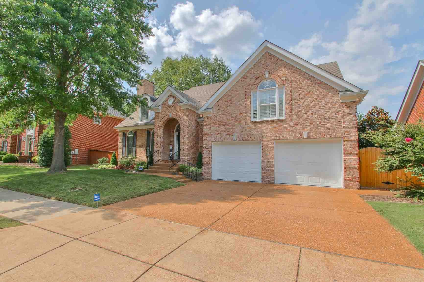 206 Polk Pl Drive Franklin, TN 37064 - Photo 46 of 47 a front view of a house with a yard and garage