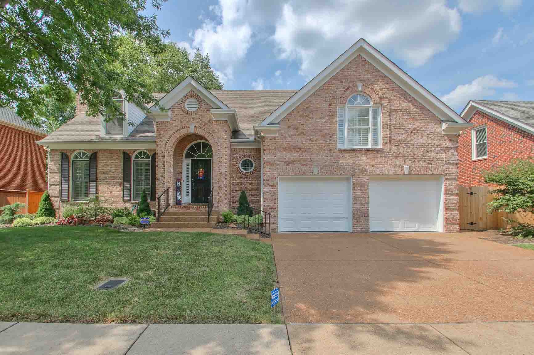 206 Polk Pl Drive Franklin, TN 37064 - Photo 47 of 47 a front view of a house with a garden