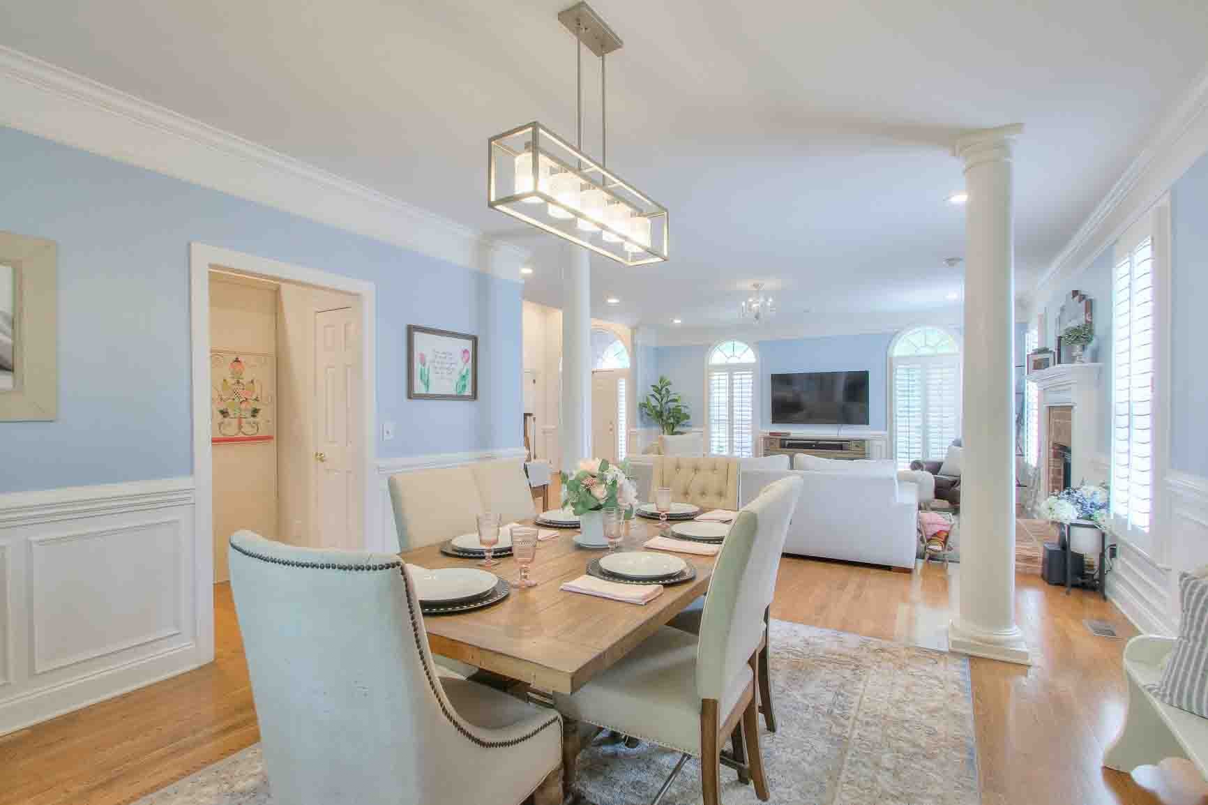 206 Polk Pl Drive Franklin, TN 37064 - Photo 9 of 47 a view of a dining room with furniture wooden floor and a chandelier