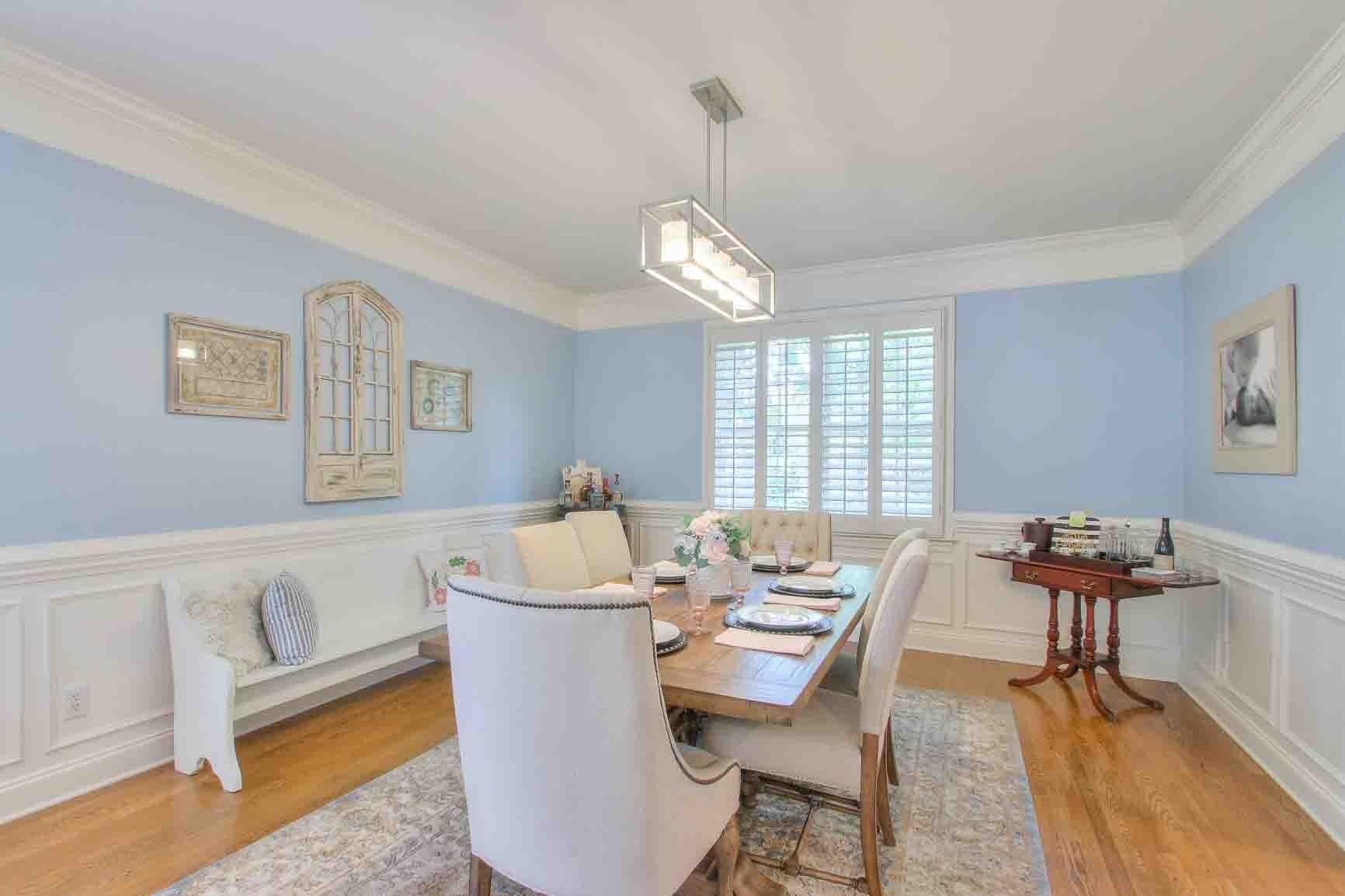 206 Polk Pl Drive Franklin, TN 37064 - Photo 10 of 47 a dining room with furniture a chandelier and wooden floor