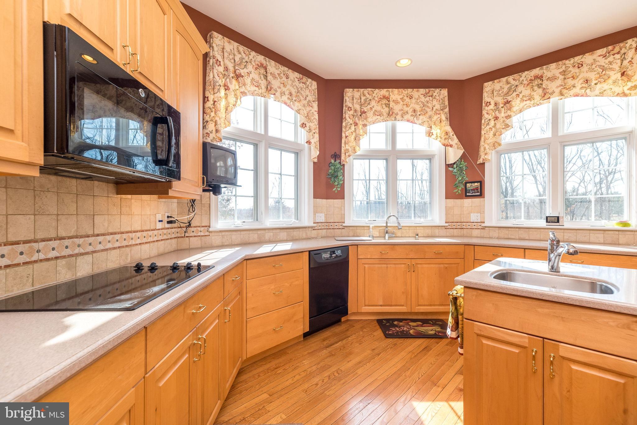 246 Rue St Andre Chalfont, PA 18914 - Photo 22 of 81 a kitchen with stainless steel appliances a sink stove and cabinets