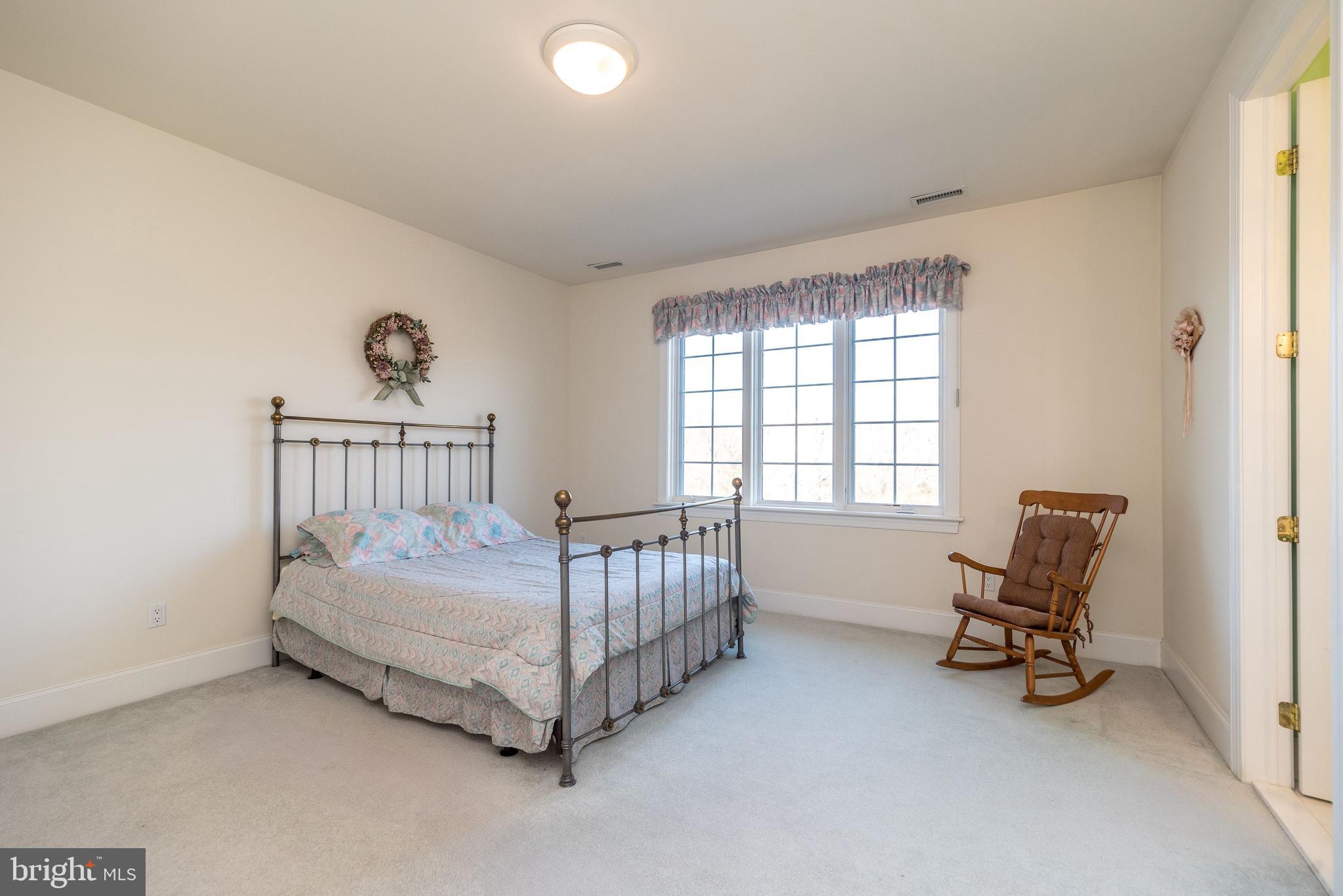 246 Rue St Andre Chalfont, PA 18914 - Photo 59 of 81 a bedroom with a bed and a chair