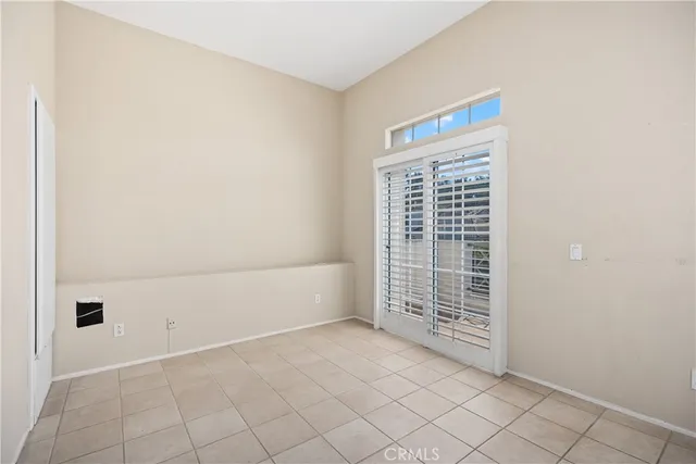 a view of an empty room with windows
