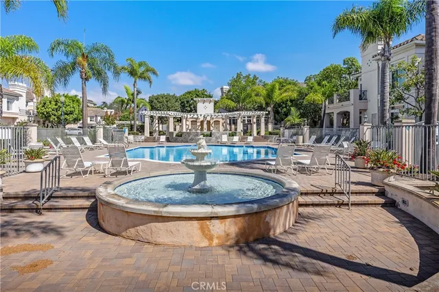 a building outdoor space with patio furniture and potted plants