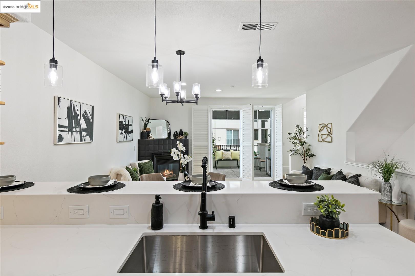 4153 Clarinbridge Circle Dublin, CA 94568 - Photo 59 of 60 a kitchen with a sink and chandelier