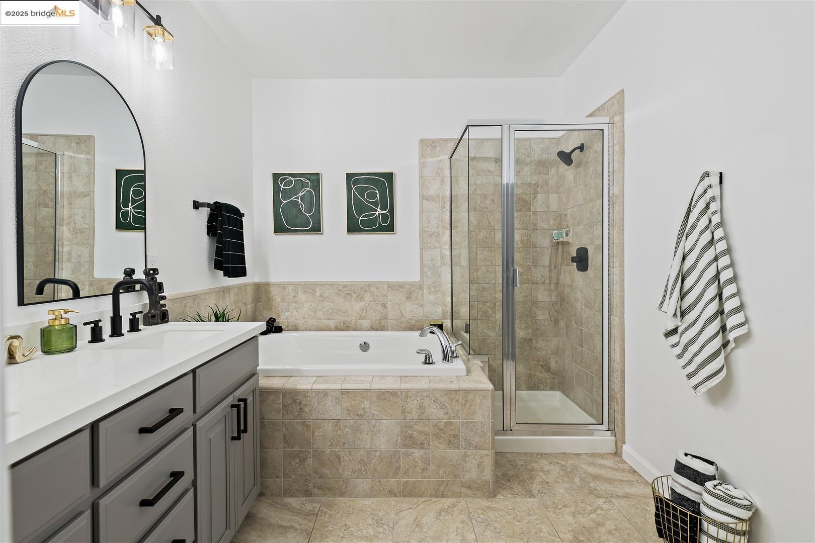 4153 Clarinbridge Circle Dublin, CA 94568 - Photo 26 of 60 a bathroom with a tub sink and mirror