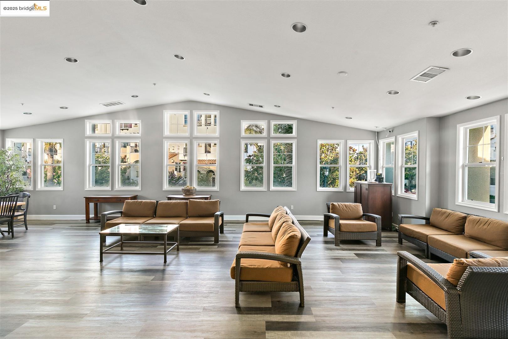 4153 Clarinbridge Circle Dublin, CA 94568 - Photo 55 of 60 a living room with furniture and floor to ceiling windows