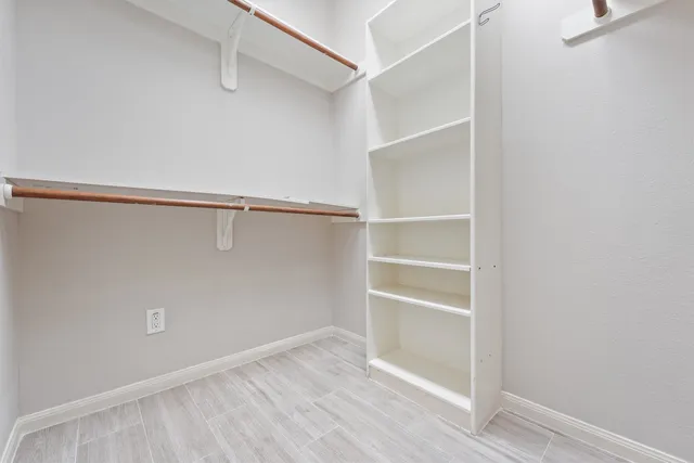 a view of an empty walk in closet