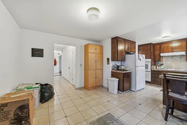 a bedroom with furniture and a flat screen tv