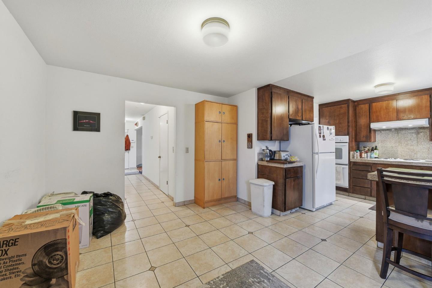 1349 Coniston Court San Jose, CA 95118 - Photo 17 of 55 a kitchen with a refrigerator and cabinets