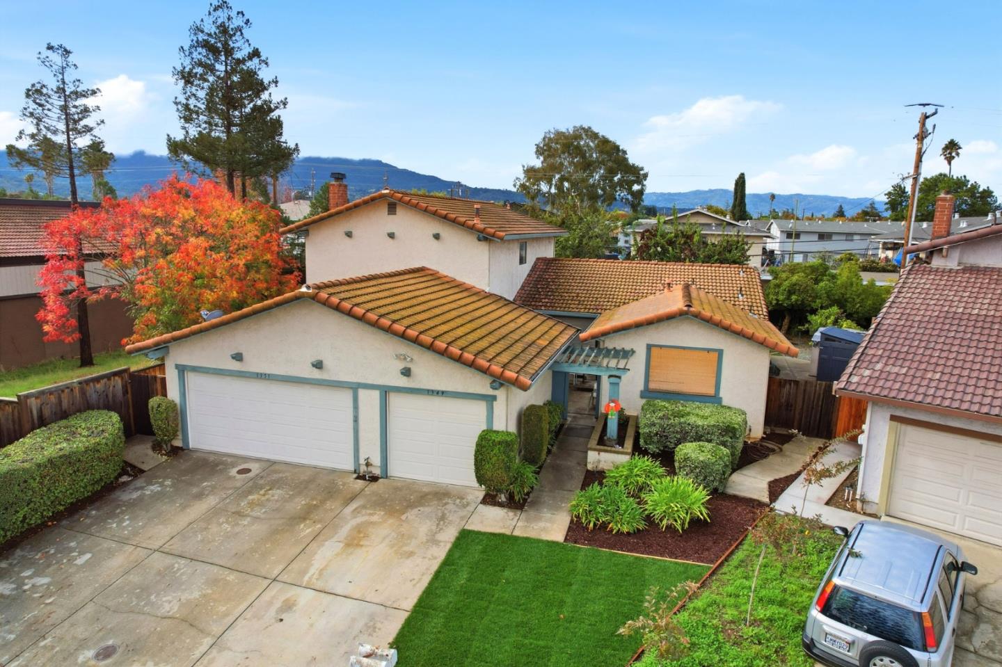 1349 Coniston Court San Jose, CA 95118 - Photo 2 of 55 a view of a white house with a yard and potted plants