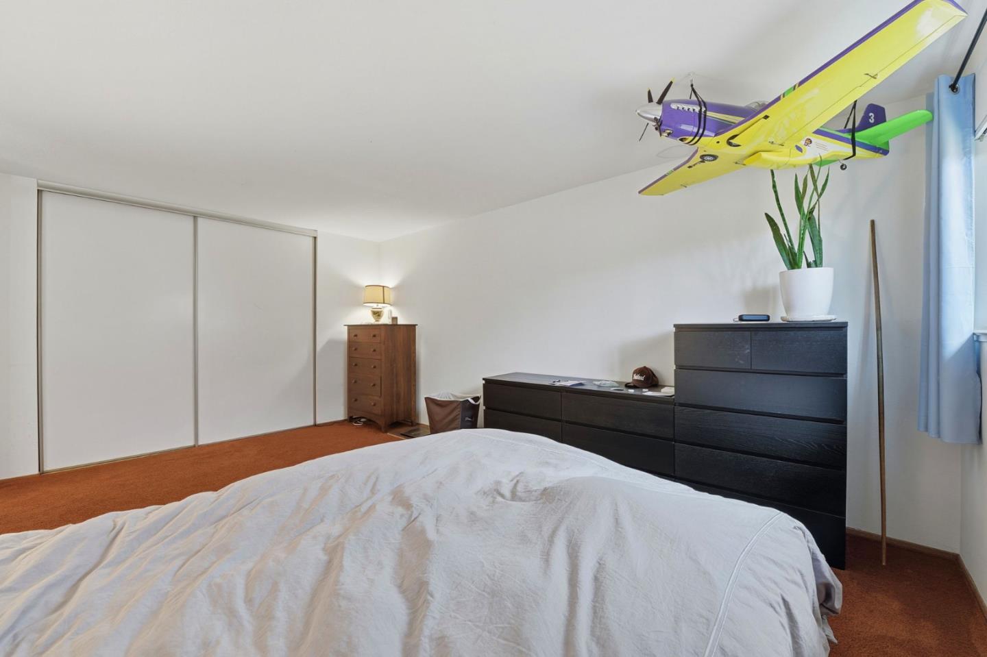 1349 Coniston Court San Jose, CA 95118 - Photo 21 of 55 a bedroom with a bed and a dresser