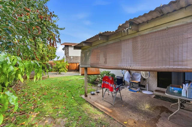 an aerial view of a house with a yard and garage