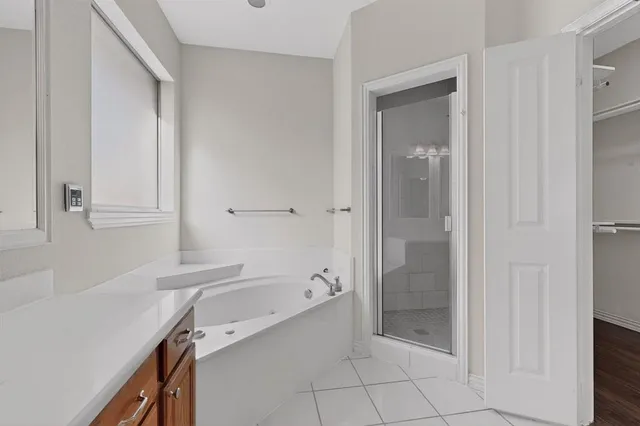 a bathroom with a sink a mirror and a shower