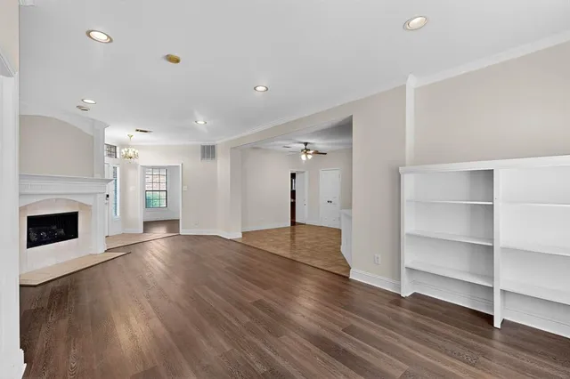 a kitchen with stainless steel appliances granite countertop a stove microwave and cabinets