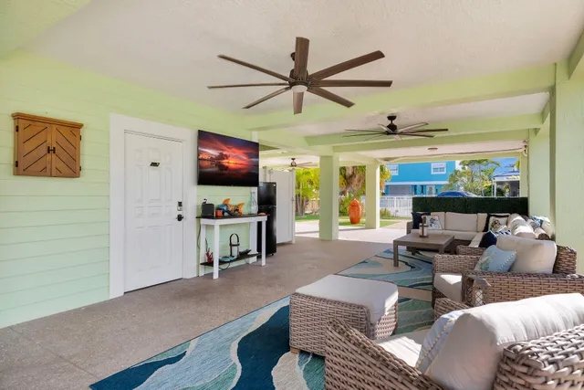 a view of a chairs and table in patio