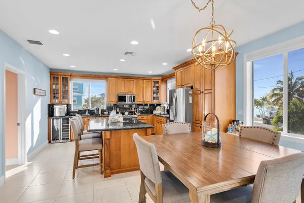 a view of a a dining room with furniture window and outside view