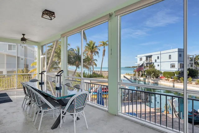 a view of a balcony with chairs