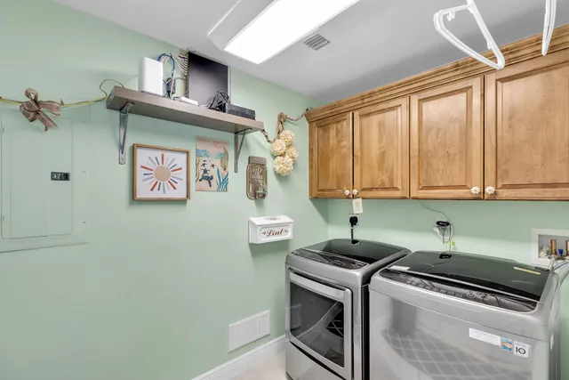 a view of balcony with two chairs and a potted plant