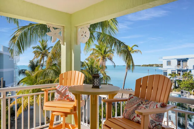 a spacious bedroom with a bed and large window