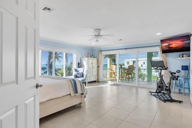 a bathroom with a granite countertop double vanity sink and a mirror