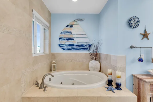 a bedroom with furniture and a flat screen tv