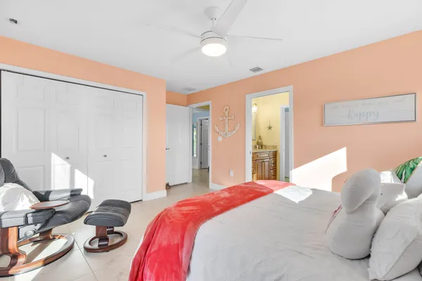 a bedroom with a bed and a shower