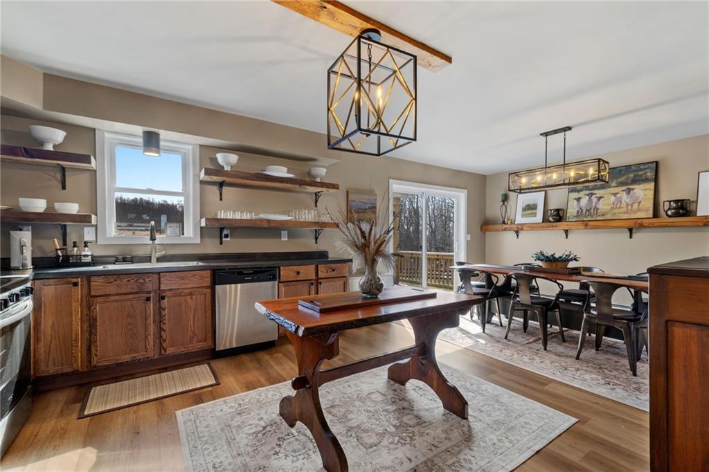 147 Fike Lane Addison, PA 15411 - Photo 38 of 50 a room with lots of tables a dining table and chairs