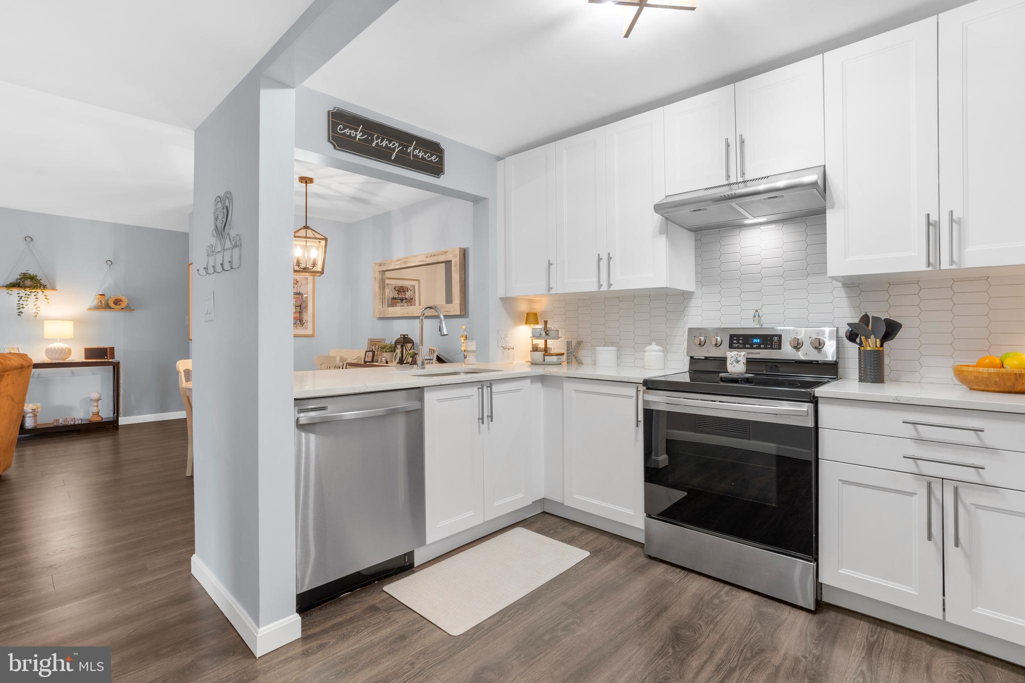 25 Church Road, Unit 56 Maple Shade, NJ 08052 - Photo 1 of 28 a kitchen with granite countertop white cabinets and white appliances