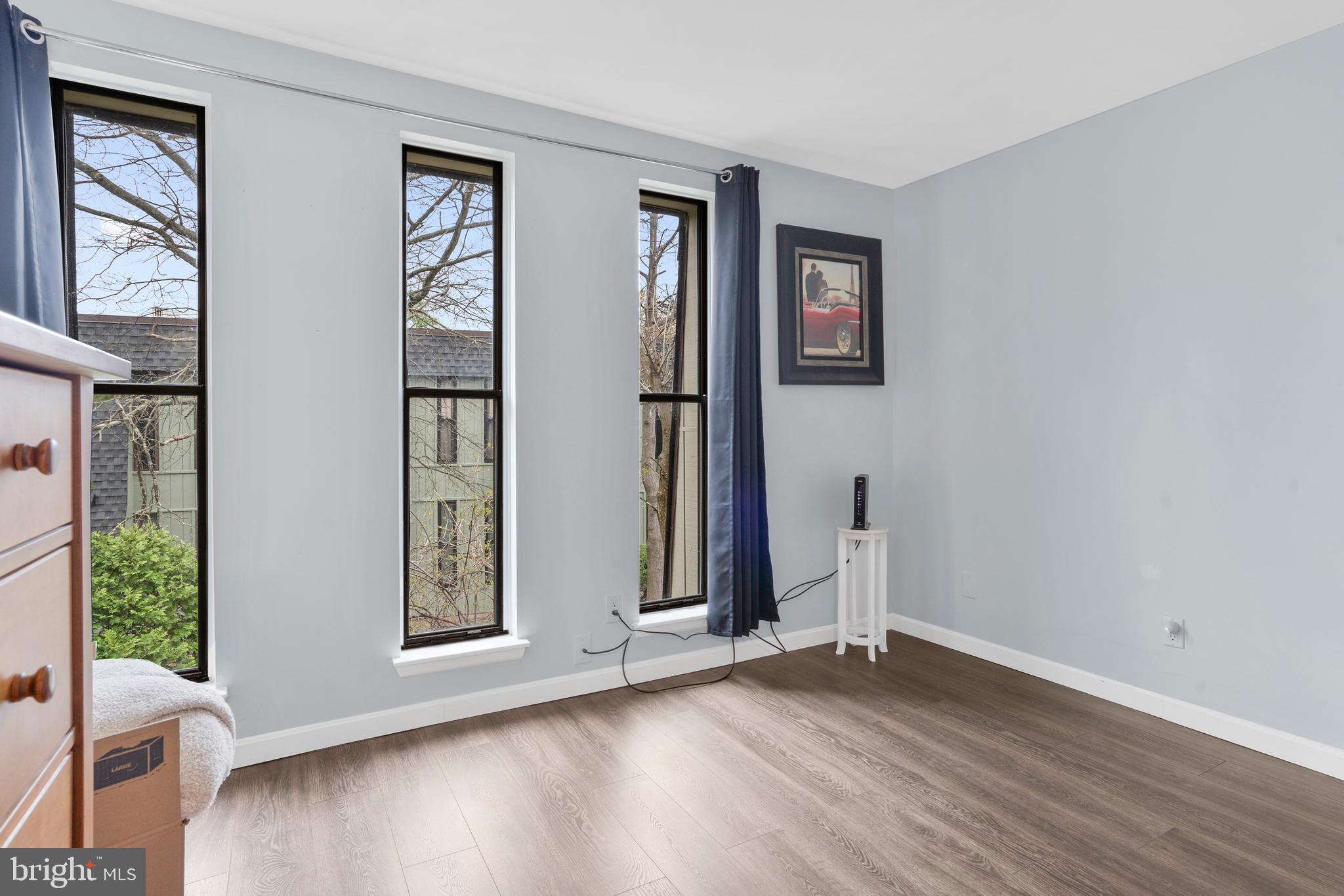 25 Church Road, Unit 56 Maple Shade, NJ 08052 - Photo 20 of 28 an empty room with wooden floor and windows