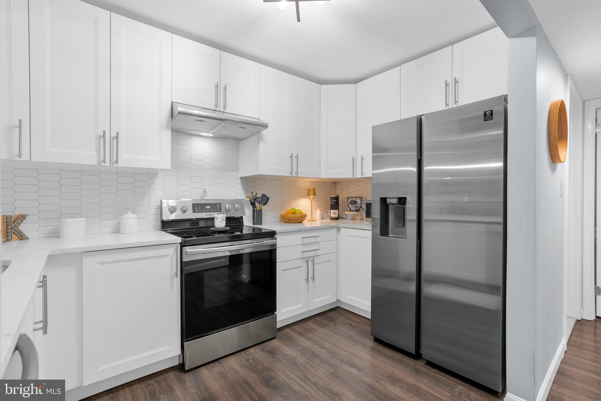 25 Church Road, Unit 56 Maple Shade, NJ 08052 - Photo 2 of 28 a kitchen with a refrigerator sink and cabinets
