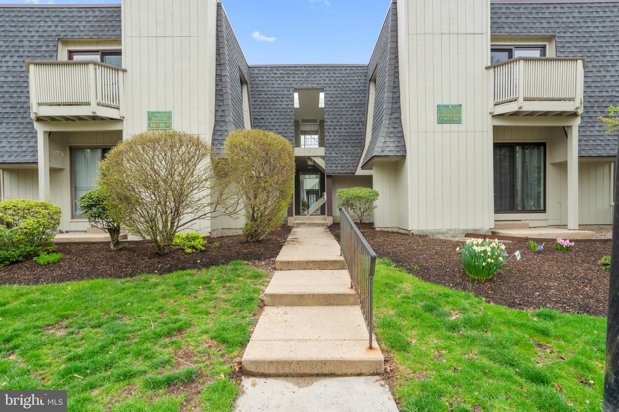 25 Church Road, Unit 56 Maple Shade, NJ 08052 - Photo 27 of 28 a front view of a house with a garden and plants