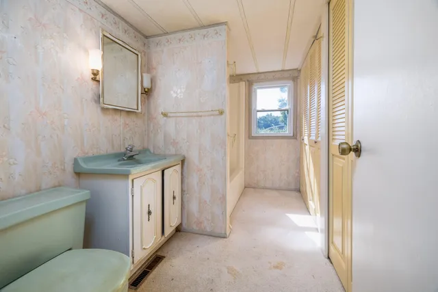 a view of a hallway with closet