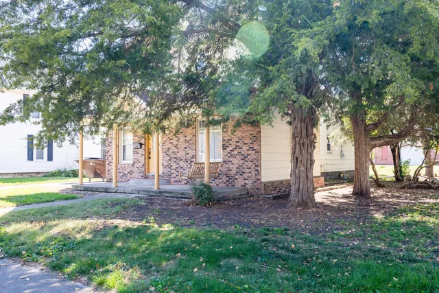 a view of a house with a tree
