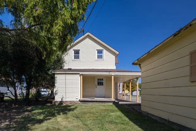 a view of a backyard with a garden