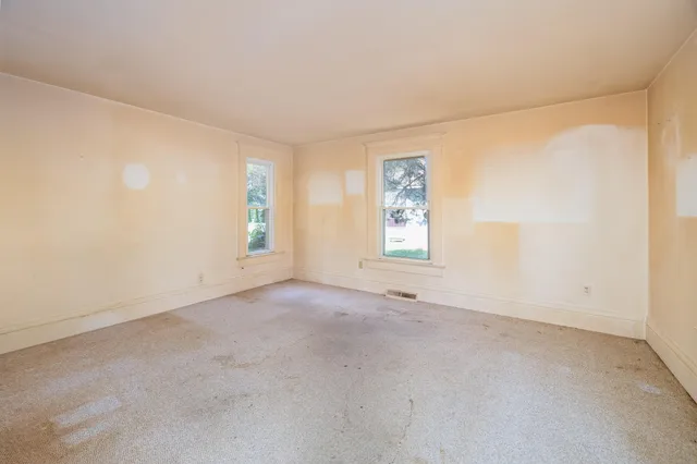 an empty room with windows