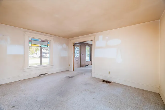 an empty room with windows