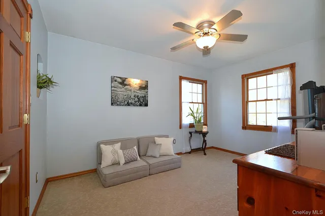 a living room with furniture and windows