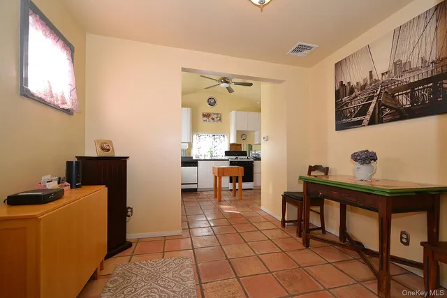 a view of a workspace with furniture