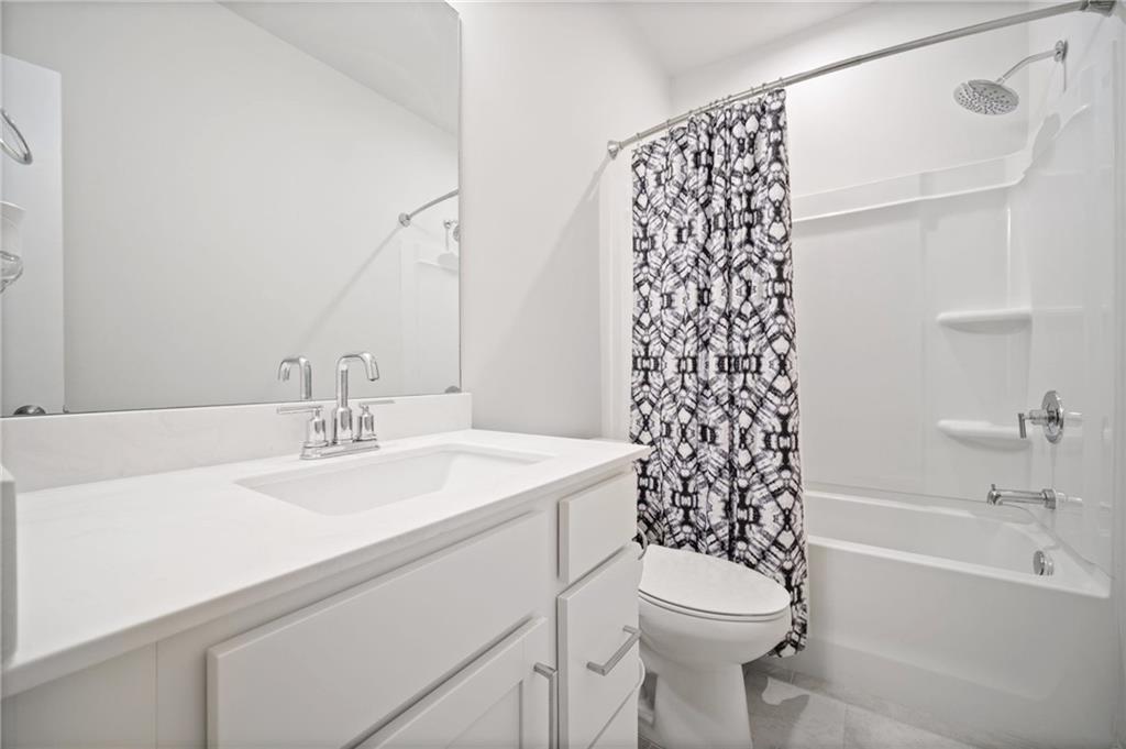 1595 Ridgebrook Downs Mableton, GA 30126 - Photo 28 of 39 a bathroom with a sink toilet and shower