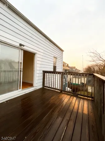 a view of balcony with wooden floor