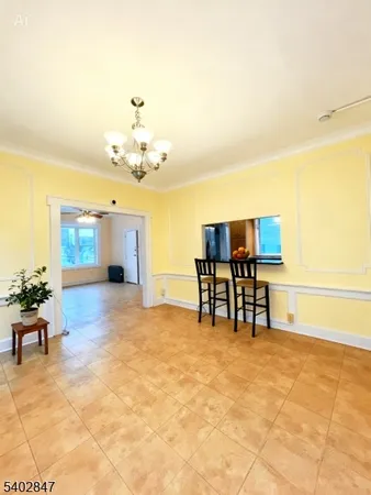 a view of a livingroom with furniture and a ceiling fan