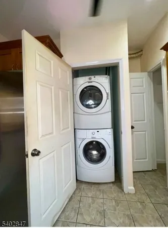 a view of a storage & utility room with washer and dryer